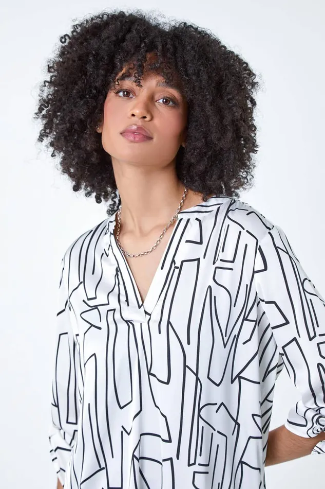 Women Ivory Abstract Print Longline VNeck Top Roman Tops